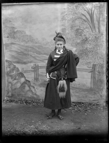 Image: Girl wearing Scottish national costume, in front of a painted backdrop, Christchurch