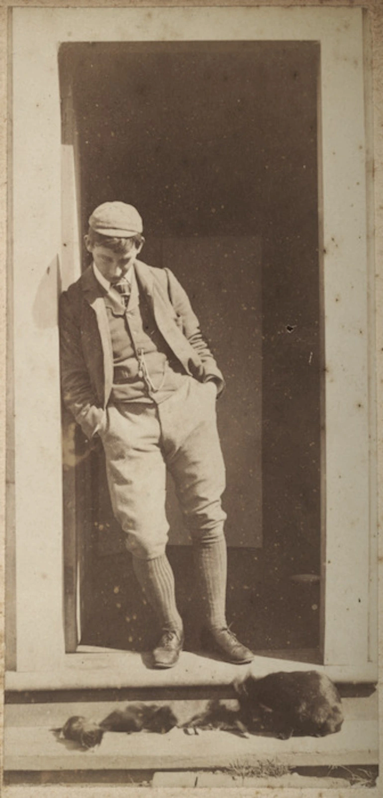 Image: Young man standing in a doorway