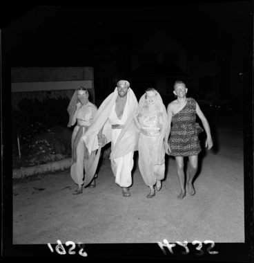 Image: Unidentified guests arriving at Arabian Nights costume party, Skyline Function Centre, Kelburn, Wellington