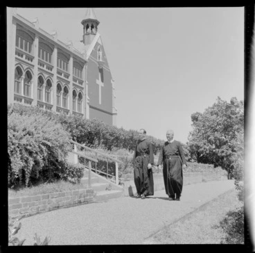 Image: Two unidentified monks walking along a garden path at St Gerard's Monastery, Wellington