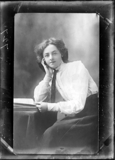 Image: Studio portrait of an unidentified girl, seated, with a book, probably Christchurch district