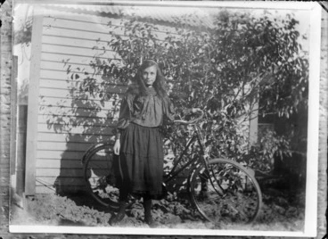 Image: Unidentified girl with bicycle outside a house, probably Christchurch district