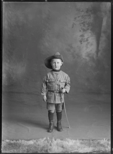 Image: Studio portrait of unidentified boy dressed as soldier with slouch hat and toy sword, probably Christchurch