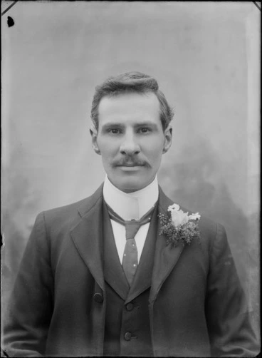 Image: Studio upper torso wedding portrait of unidentified groom with moustache and imperial shirt collar, polka dot tie and buttonhole, Christchurch