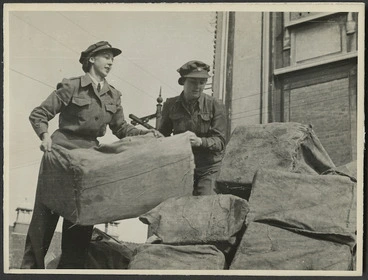 Image: Women from the Post and Telegraph Department lifting mail bags - Photograph taken by Government Film Studios