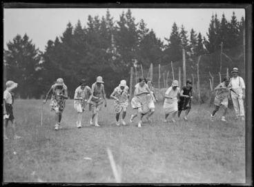Image: Women competing in an egg and spoon race
