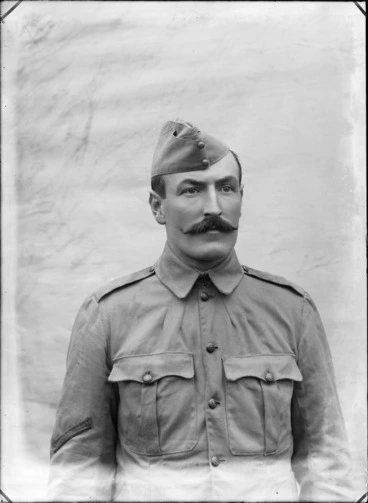 Image: Upper torso portrait of unidentified World War I Lance Corporal with handlebar moustache and forge cap, probably Christchurch region