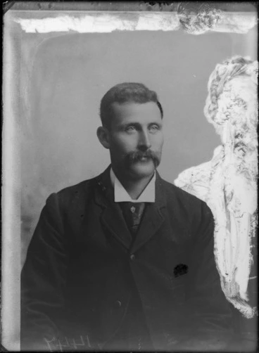 Image: Seated studio portrait of an unidentified man with moustache, wearing a suit and tie, Christchurch