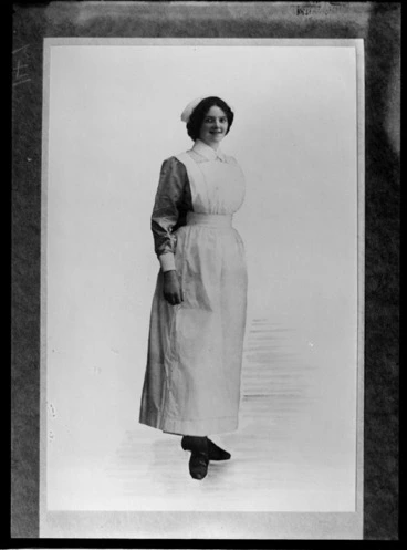Image: Full length portrait of an unidentified woman, in a nurse's uniform, probably Christchurch district