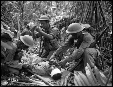 Image: Attending to a wounded World War II soldier, Pacific region