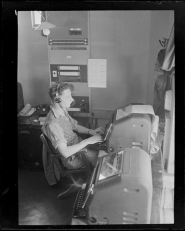 Image: Telegraph Operator B V Richards, sending a telegraph, Musick Point Air Radio Station, Howick, Auckland