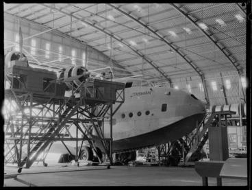 Image: Side and nose view of a Short Tasman aircraft, in a workshop, Hobsonville, Auckland, including scaffolding