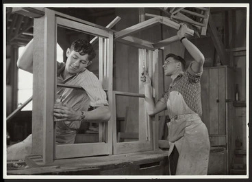 Image: Carpenters working on window frames for state houses, New Zealand