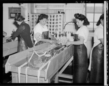 Image: Women testing sausage casings at Westfield Freezing works, Otahuhu, Auckland - Photograph taken by W Walker