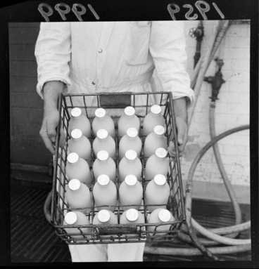 Image: A crate of bottled milk, in a factory, location unidentified