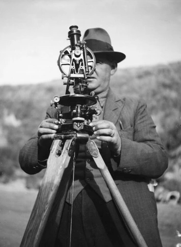 Image: Engineer setting up a theodolite - Photograph taken by J D Pascoe