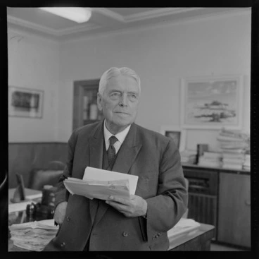 Image: Prime Minister Walter Nash in his office holding telegrams with birthday greetings for his 78th birthday