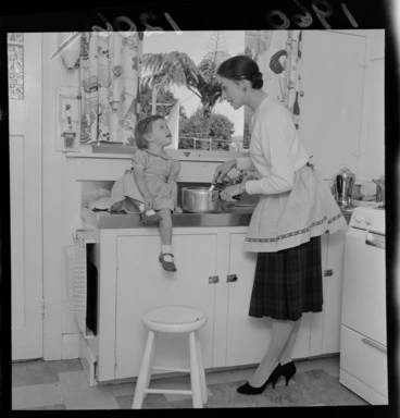 Image: Mrs Walter Trevor (Sara Neil), ballerina, at home with her young daughter in the kitchen