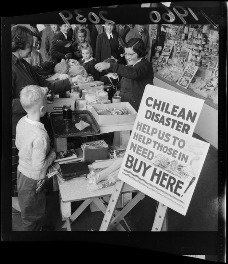 Image: Polio victim holds food stall to raise money for the victims of the disaster in Chile