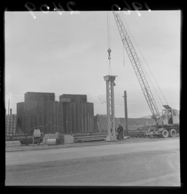 Image: View of pylons being moved for the Hutt Road Reclamation Bridge with unidentified workmen, Wellington City