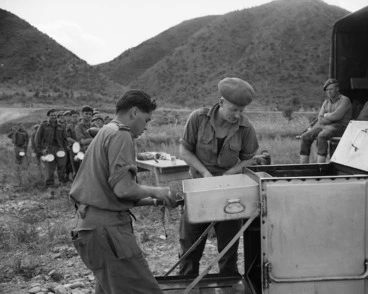 Image: Lance Corporal J Calincos and Driver J Cummings serving lunch to men of the Composite Platoon, Korea