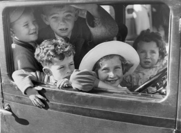Image: Photograph of a group of children in a car
