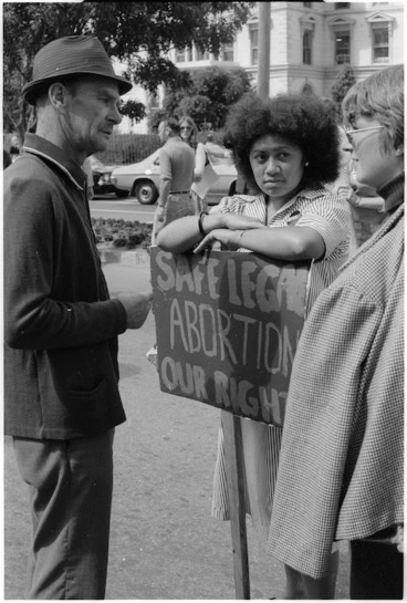 Image: Man talking with two female pro-choice demonstrators at the 1978 International Women's Day march, Wellington