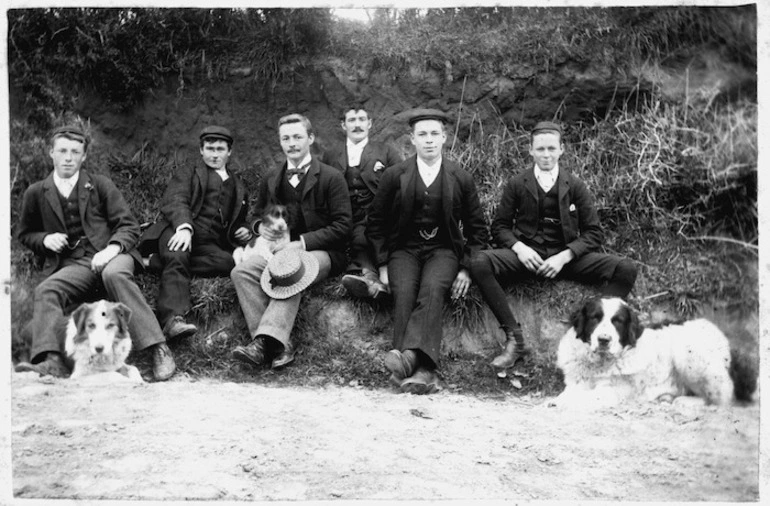 Image: Young men and dogs