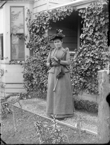 Image: Lydia Williams, outside her home, with leaves growing on the front entrance, Maitland Street, View Bank, Dunedin