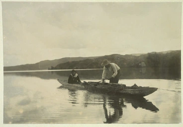 Image: Two people fishing from a waka, Lake Rotoiti