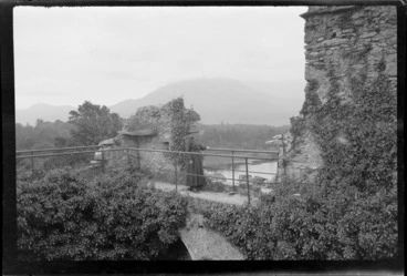 Image: Lydia Williams standing on ramparts of castle ruins, looking out towards lake and mountains, Killarney, County Kerry, Ireland