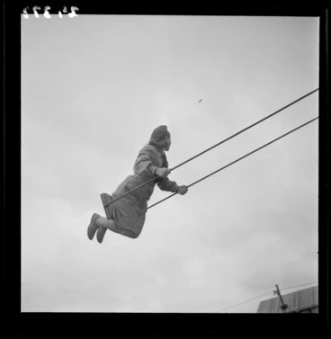 Image: Girl playing on a swing at a Polish refugee camp in Pahiatua