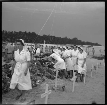 Image: New Zealand nurses placing wreaths on the graves of fellow workers, El Ballah, Egypt, during World War 2