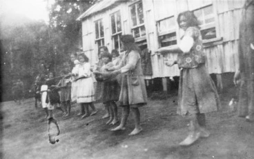 Image: Children performing a poi dance outside the school at Ruatahuna