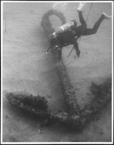Image: Scuba diver on the sea bed at Doubtless Bay alongside the first of the three anchors of the St Jean Baptiste to be discovered