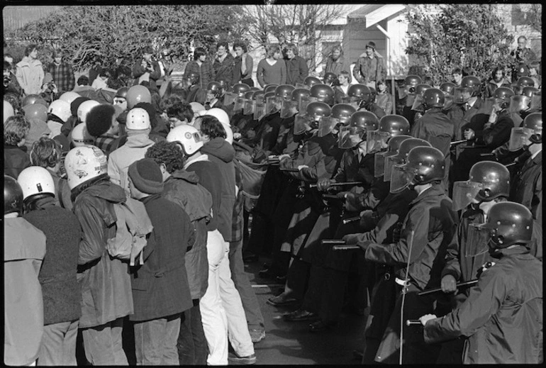 Image: Demonstrators against the Springbok rugby tour turn away from police in Cuba Street, Palmerston North - Photograph taken by Don Scott