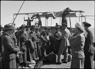 Image: Lady Freyberg and Brigadier Falconer welcoming the first draft of Tuis, the welfare division of the Women's Army Auxiliary Corps, on a wharf at Tewfik, Egypt