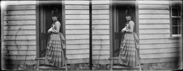 Image: Lydia Williams holding a puppy at the door of her house in Carlyle Street, Napier