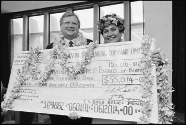 Image: Prime Minister David Lange and Mrs Rosalie Blake with a cheque for the Cyclone Bola relief fund - Photograph taken by Phil Reid