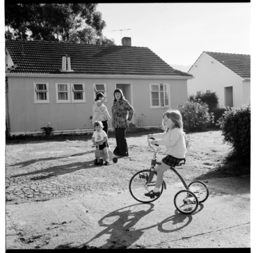 Image: Child on a tricycle, possibly in the Avalon area of Lower Hutt