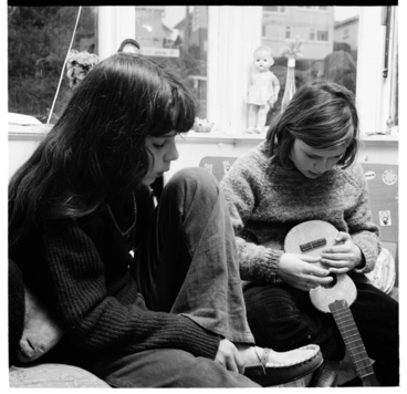Image: Two young girls with a ukulele, and sketchbook