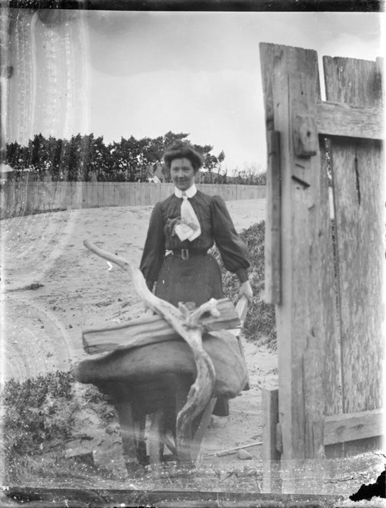 Image: Woman with driftwood