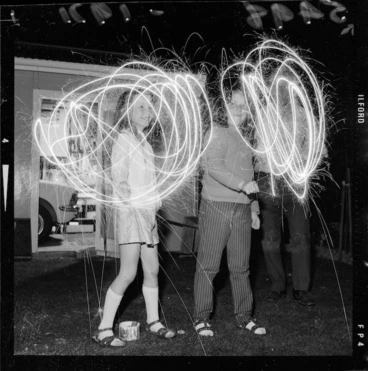 Image: Anne Herrington and Tracy Kelly holding sparklers on Guy Fawkes Day, Wainuiomata, Wellington