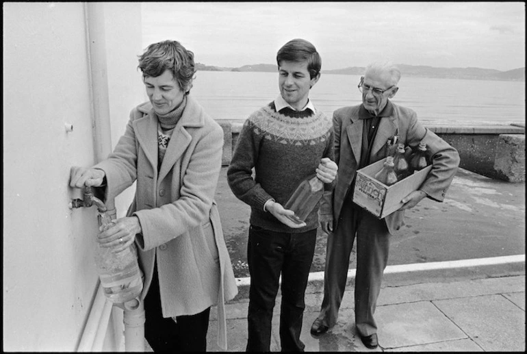 Image: People bottling pure water from a tap at the Petone Settlers Museum - Photograph taken by Phil Reid