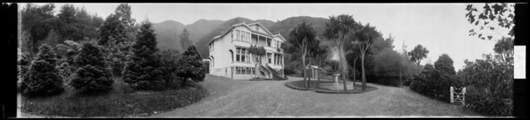 Image: Three-storied house surrounded by trees