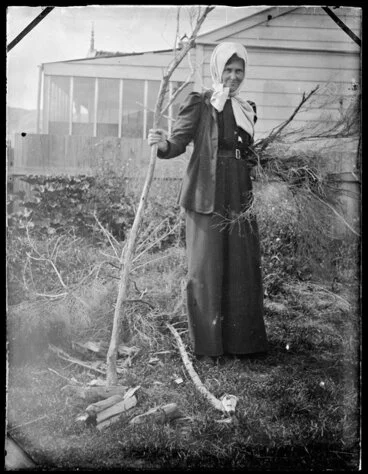 Image: Woman holding branch