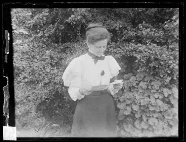 Image: Woman reading in garden