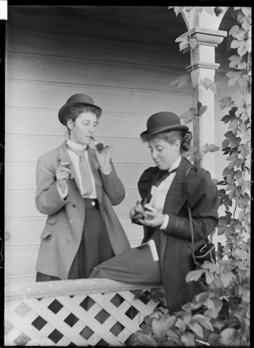 Image: Gertie Tewsley smoking a pipe with Ethel Haggitt
