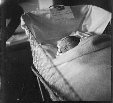 Image: Martha Pascoe as a new baby, in a cot