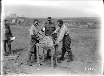 Image: Members of the Maori Pioneer Battalion sharpening a hatchet at Bayencourt during World War I